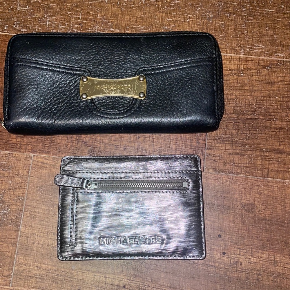 Two Michael kors wallets .